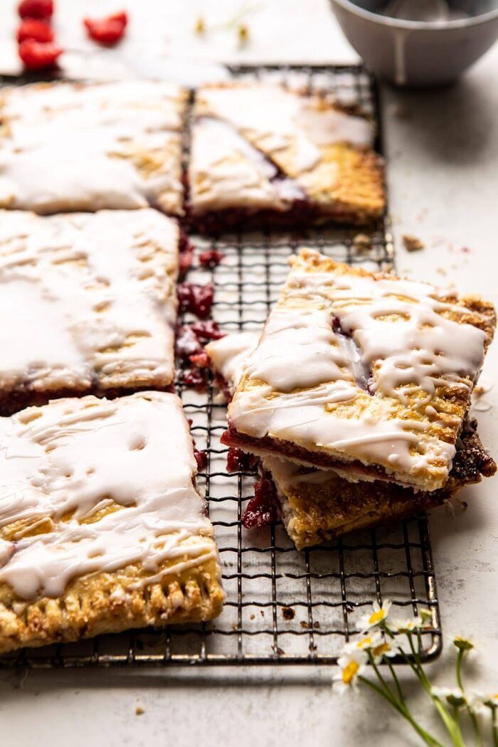 Giant Strawberries n' Cream Pop Tart | halfbakedharvest.com #brunch #pie #dessert #breakfast Giant Strawberries n' Cream Pop Tart stacked on top of each other