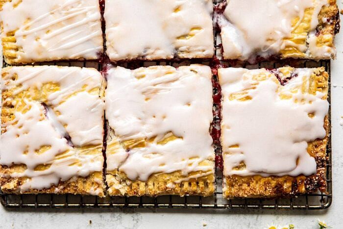 Giant Strawberries n' Cream Pop Tart | halfbakedharvest.com #brunch #pie #dessert #breakfast horizontal photo of Giant Strawberries n' Cream Pop Tart