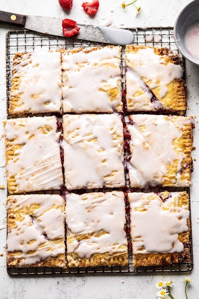 Giant Strawberries n' Cream Pop Tart | halfbakedharvest.com #brunch #pie #dessert #breakfast overhead photo of Giant Strawberries n' Cream Pop Tart