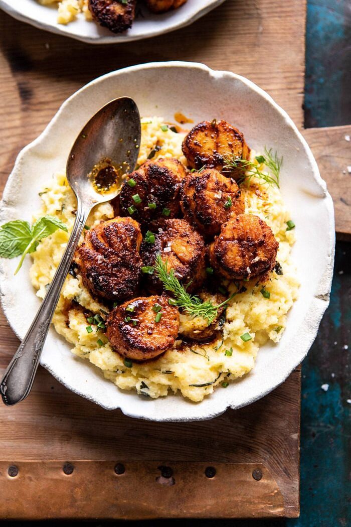 Honey Butter Blackened Scallops with Herby Polenta | halfbakedharvest.com #seafood #scallops #easyrecipes #dinnerrecipes overhead close up photo of Honey Butter Blackened Scallops with Herby Polenta with spoon on plate