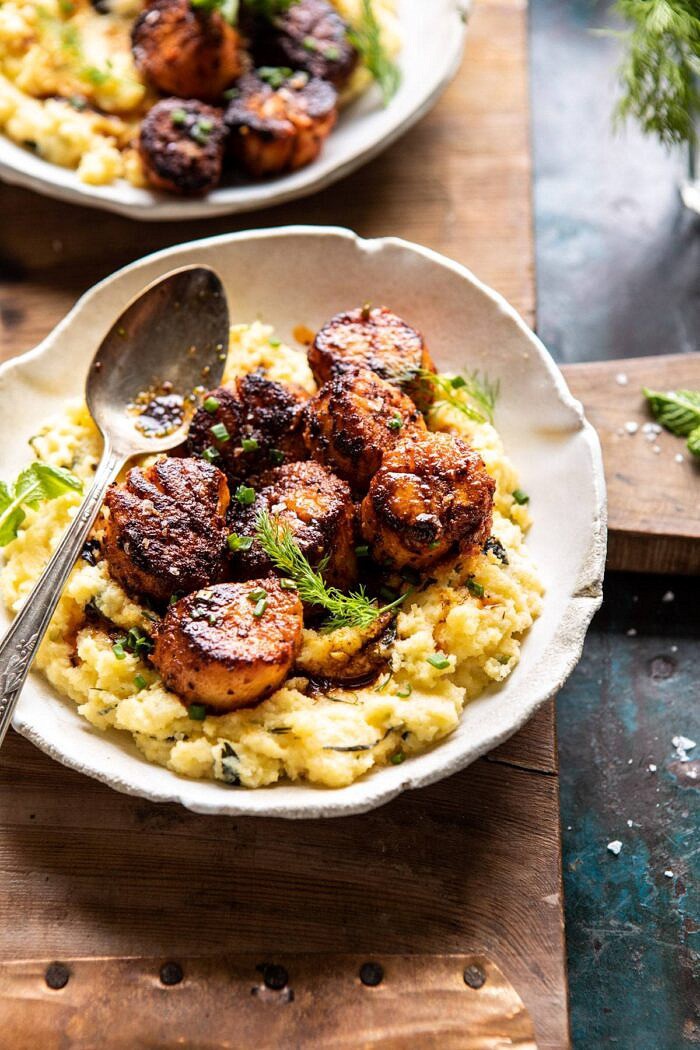 Honey Butter Blackened Scallops with Herby Polenta | halfbakedharvest.com #seafood #scallops #easyrecipes #dinnerrecipes side angled photo of Honey Butter Blackened Scallops with Herby Polenta