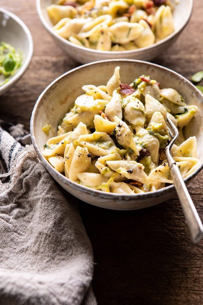 side angled photo of Instant Pot Irish Cheddar Bacon Mac and Cheese with fork in bowl