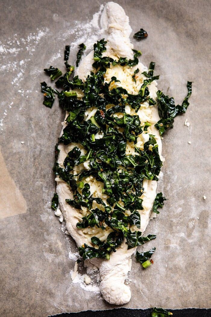 Khachapuri (Georgian Cheese Bread) with Kale before baking