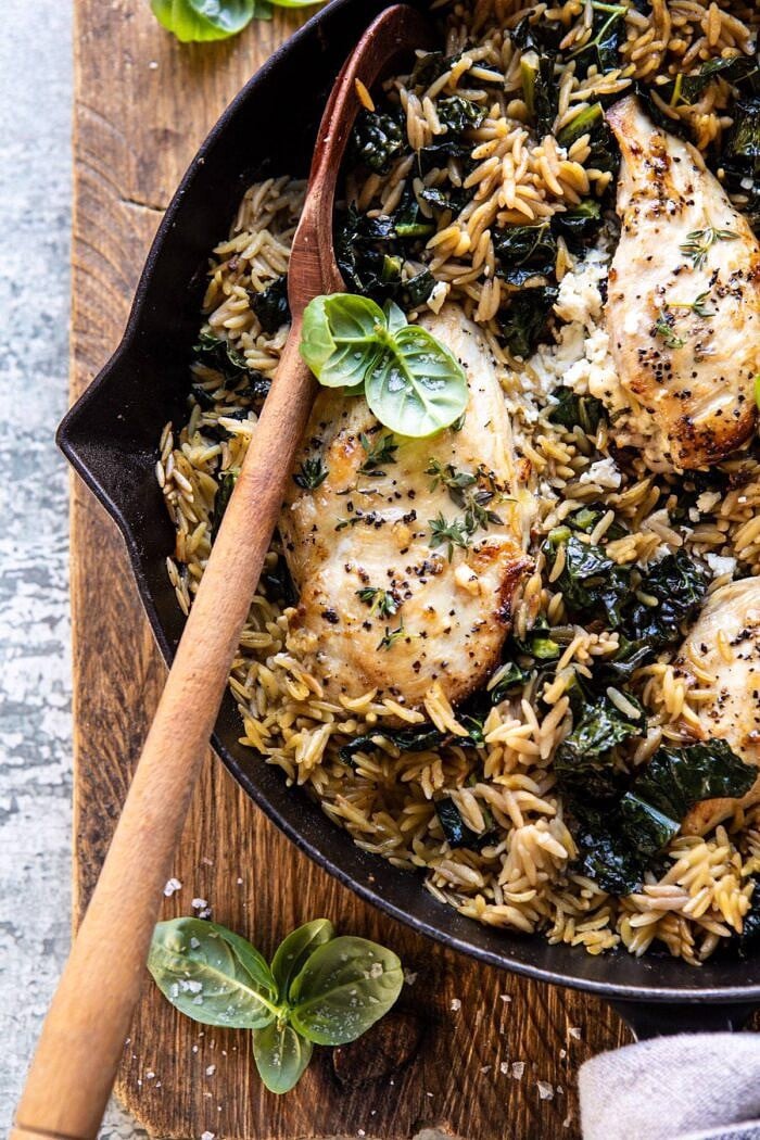 One Skillet Goat Cheese Stuffed Chicken and Orzo | halfbakedharvest.com #skilletchicken #skilletrecipes #easyrecipes #dinner overhead close up photo of One Skillet Goat Cheese Stuffed Chicken and Orzo