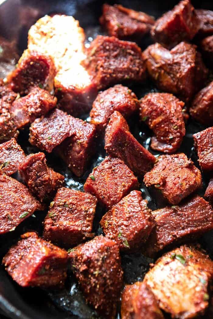 30 Minute Cajun Butter Steak and Peppers | halfbakedharvest.com #easyrecipes #steak #dinner #familyrecipes Cajun Butter Steakin skillet cooking