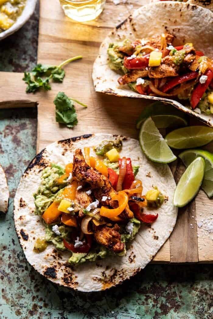 30 Minute Chicken Fajitas with Roasted Pineapple Salsa Verde | halfbakedharvest.com #chickenrecipes #mexicanrecipes #dinner #fajitas #healthyrecipes side angle close up photo of 30 Minute Chicken Fajitas with Roasted Pineapple Salsa Verde