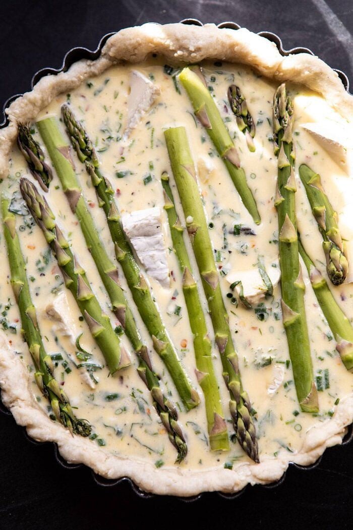 Asparagus and Brie Quiche | halfbakedharvest.com #quiche #brunch #springrecipes #easter overhead photo of Asparagus and Brie Quiche before baking