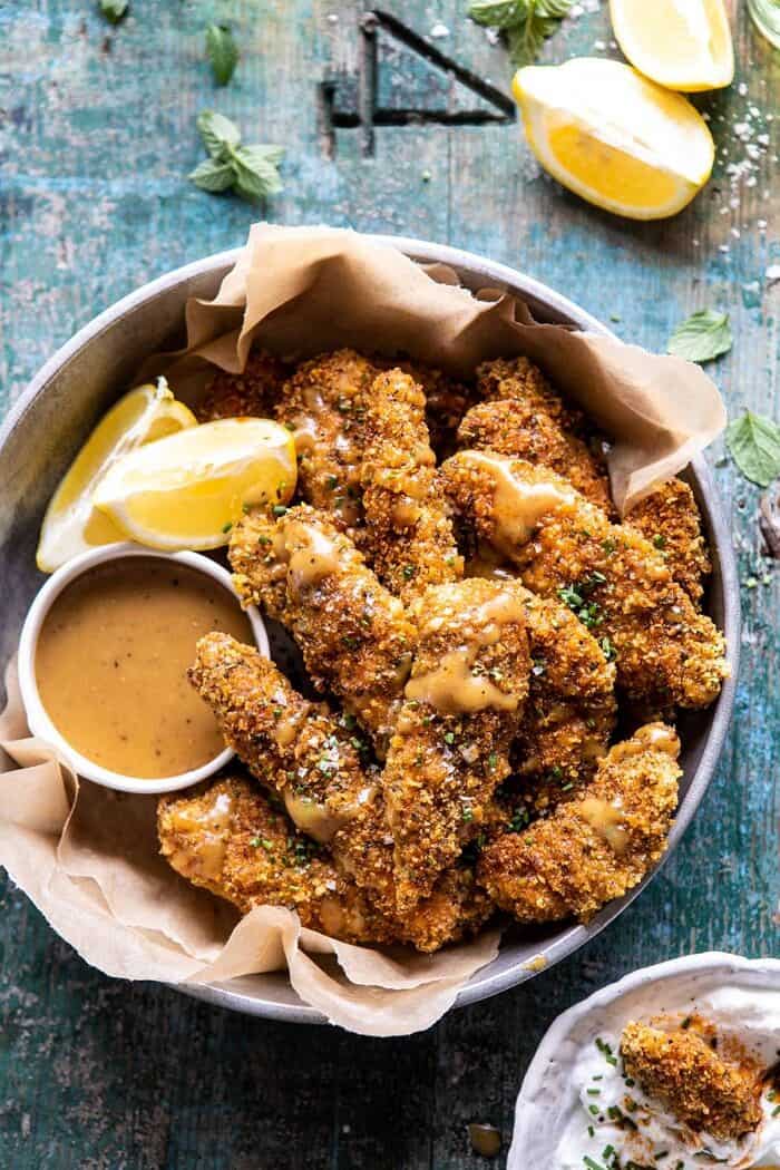 Baked Black Pepper Ranch Chicken Fingers with Honey Mustard | halfbakedharvest.com #chicken #easyrecipes #dinner #chickenfingers overhead close up photo of Baked Black Pepper Ranch Chicken Fingers with Honey Mustard