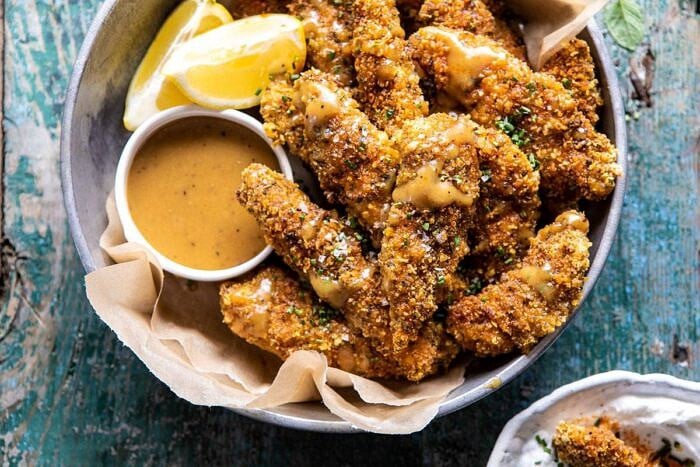 Baked Black Pepper Ranch Chicken Fingers with Honey Mustard | halfbakedharvest.com #chicken #easyrecipes #dinner #chickenfingers horizontal photo of Baked Black Pepper Ranch Chicken Fingers with Honey Mustard