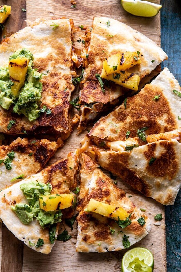 Cauliflower Al Pastor Quesadillas with Lime Smashed Avocado | halfbakedharvest.com #vegan #Mexican #cauliflower #pineapple #sandwich #easyrecipes #cheese overhead close up photo of Cauliflower Al Pastor Quesadillas with Lime Smashed Avocado