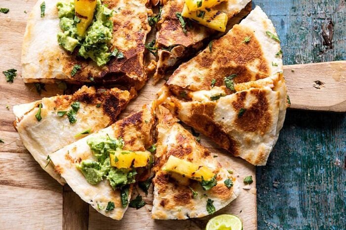 Cauliflower Al Pastor Quesadillas with Lime Smashed Avocado | halfbakedharvest.com #vegan #Mexican #cauliflower #pineapple #sandwich #easyrecipes #cheese horizontal photo of Cauliflower Al Pastor Quesadillas with Lime Smashed Avocado