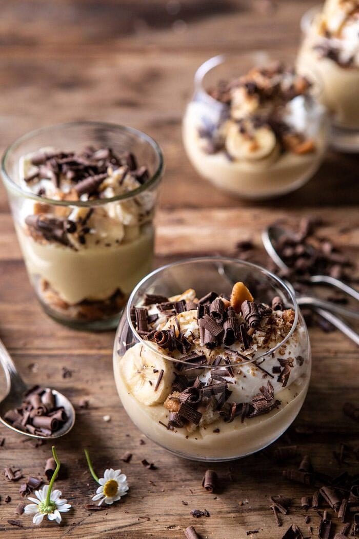 Coconut Banana Cream Pie Parfaits | halfbakedharvest.com #coconutpie #banana #dessertrecipes #easter close up overhead photo of of Coconut Banana Cream Pie Parfaits