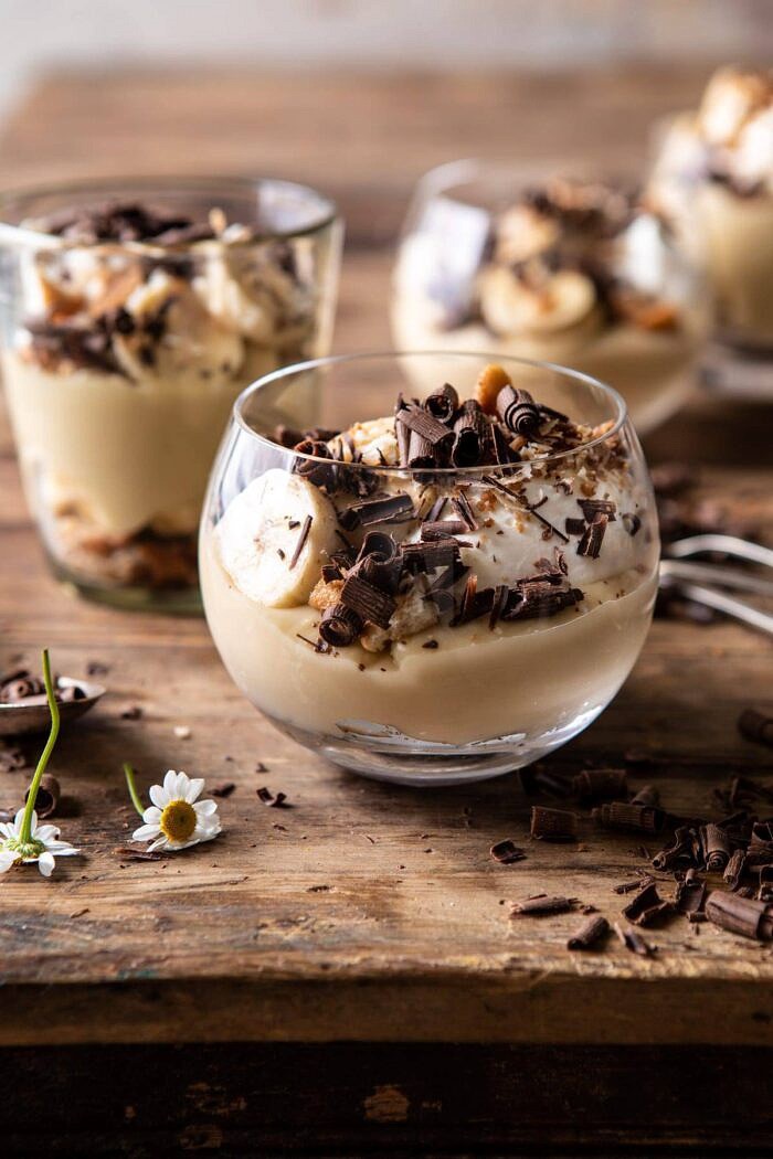 Coconut Banana Cream Pie Parfaits | halfbakedharvest.com #coconutpie #banana #dessertrecipes #easter close up side angled photo of Coconut Banana Cream Pie Parfaits