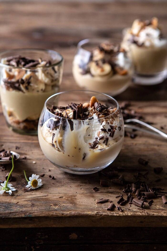 Coconut Banana Cream Pie Parfaits | halfbakedharvest.com #coconutpie #banana #dessertrecipes #easter Coconut Banana Cream Pie Parfaits with bite taken out of parfaits