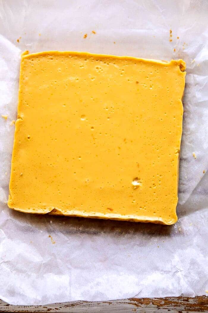 Creamy Lemon Bars with Browned Butter Raspberries | halfbakedharvest.com #lemon #brownbutter #spring #summer #easter #mothersday #brunch #dessert Creamy Lemon Bars before cutting