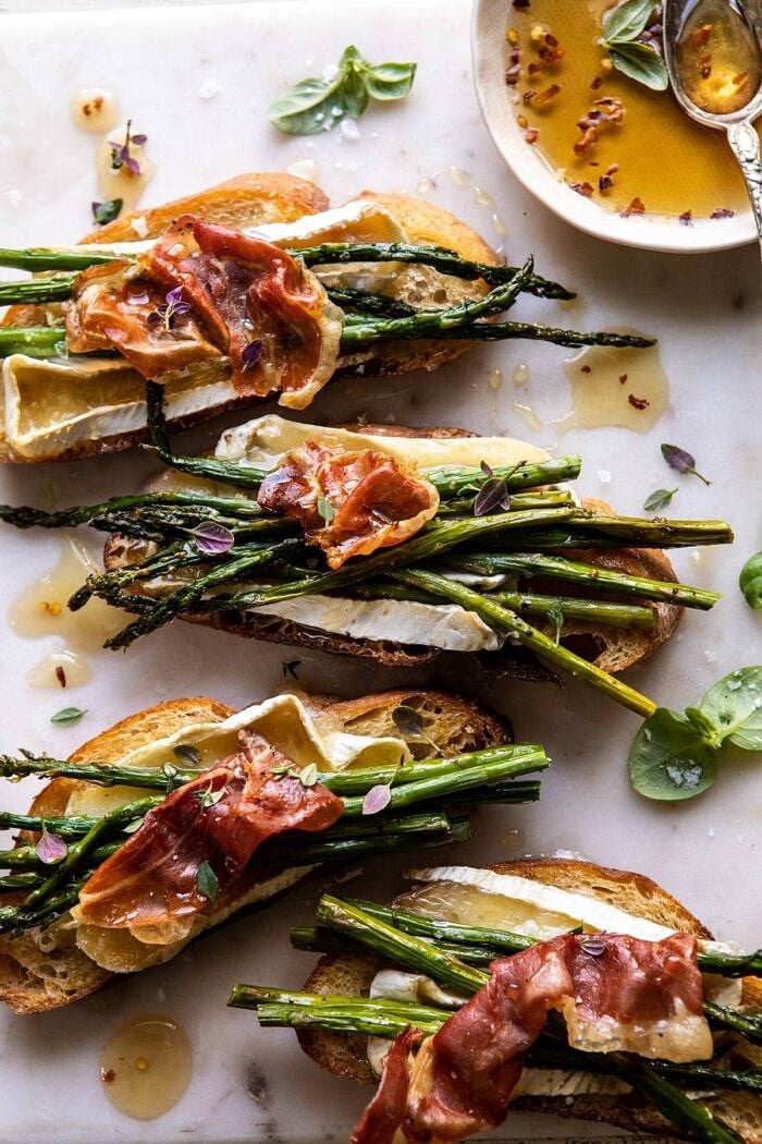 Crispy Prosciutto, Asparagus, and Brie Toast | halfbakedharvest.com #easyrecipes #appetizers #brie #mothersday #spring #summer overhead close up photo of Crispy Prosciutto, Asparagus, and Brie Toast
