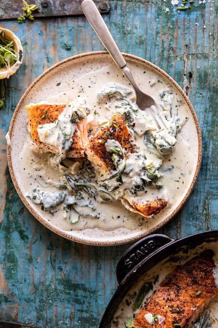 Garlic Butter Creamed Spinach Salmon | halfbakedharvest.com #salmon #easyrecipes #seafood #dinner overhead photo of Garlic Butter Creamed Spinach Salmon plate