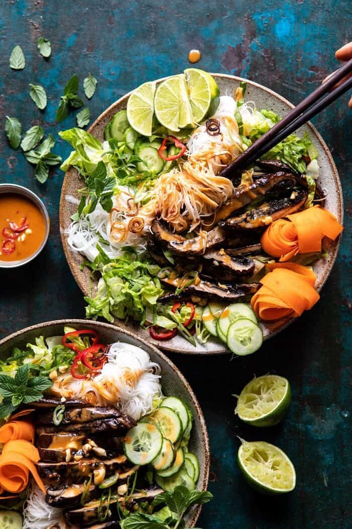 Vietnamese Rice Noodle Salad with Mushrooms and Spicy Peanut Vinaigrette | halfbakedharvest.com #healthy #salad #springrecipes #Asian Vietnamese Rice Noodle Salad with Mushrooms and Spicy Peanut Vinaigrette with chopsticks in bowl