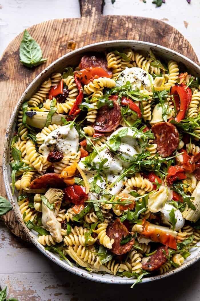 Antipasto Pasta Salad with Herby Parmesan Vinaigrette | halfbakedharvet.com #pasta #easyrecipes #pastasalad #mothersday overhead close up photo of Antipasto Pasta Salad with Herby Parmesan Vinaigrette