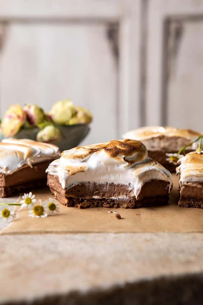 S'mores Chocolate Mousse Bars | halfbakedharvest.com #smores #dessert #chocolate #summerrecipes side angled photo of S'mores Chocolate Mousse Bars with bite taken out of bars