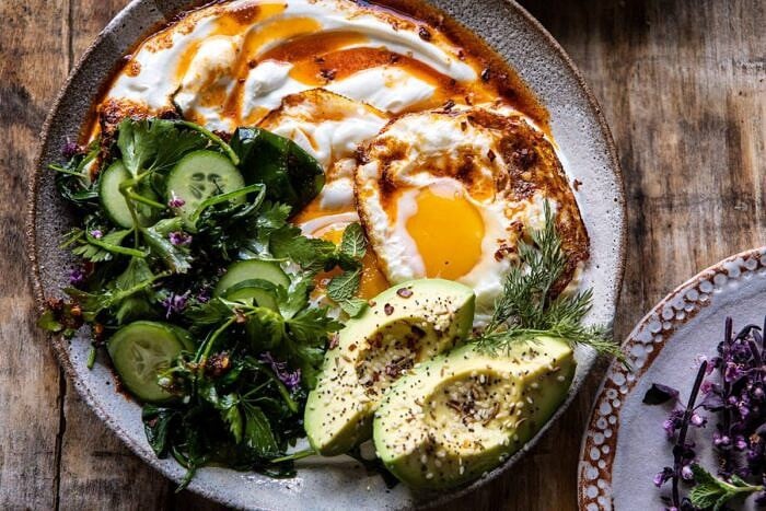 Turkish Eggs with Chile Butter and Whipped Feta | halfbakedharvest.com #breakfast #brunch #healthyrecipes #eggs #spring #summer horizontal photo of Turkish Eggs with Chile Butter and Whipped Feta
