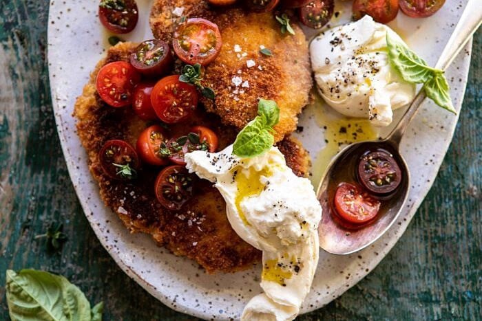 horizontal photo of Basil Chicken Saltimbocca with Marinated Tomatoes and Burrata 