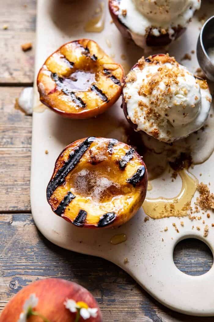 Browned Butter Grilled Peaches with Cinnamon Toast Brioche Crumbs | halfbakedharvest.com #summerrecipes #peaches #icecream #easyrecipes close up side angled photo Browned Butter Grilled Peaches