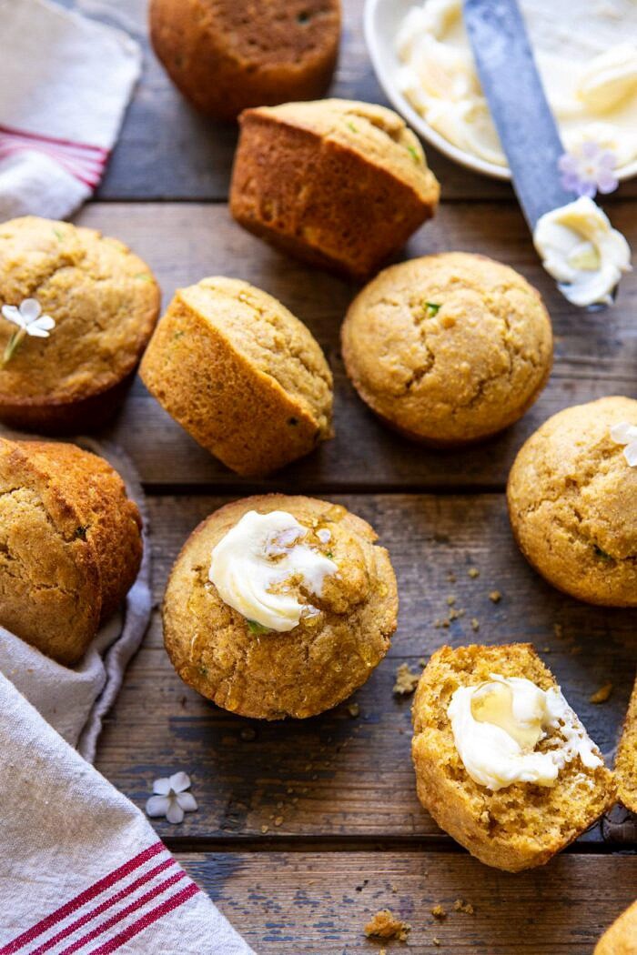 Browned Butter Jalapeño Cornbread Muffins | halfbakedharvest.com #cornbread #easyrecipes #brownedbutter side angled photo of Browned Butter Jalapeño Cornbread Muffins with butter and honey on muffin
