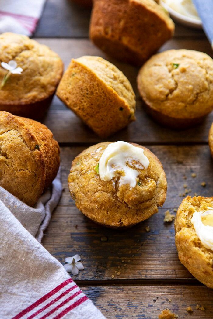 Browned Butter Jalapeño Cornbread Muffins | halfbakedharvest.com #cornbread #easyrecipes #brownedbutter front on close up photo of Browned Butter Jalapeño Cornbread Muffins with butter