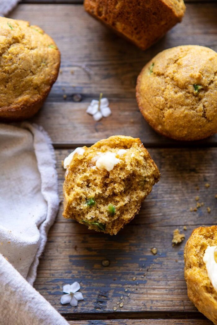 Browned Butter Jalapeño Cornbread Muffins | halfbakedharvest.com #cornbread #easyrecipes #brownedbutter Browned Butter Jalapeño Cornbread Muffin broken in half with butter on muffin