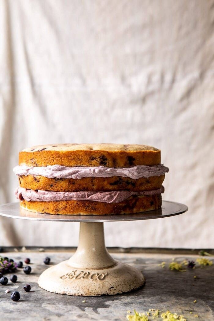 Bursting Blueberry Lemon Layer Cake | halfbakedharvest.com #bleberrycake #layercake #summerrecipes #dessert front on photo of Bursting Blueberry Lemon Layer Cake before frosting