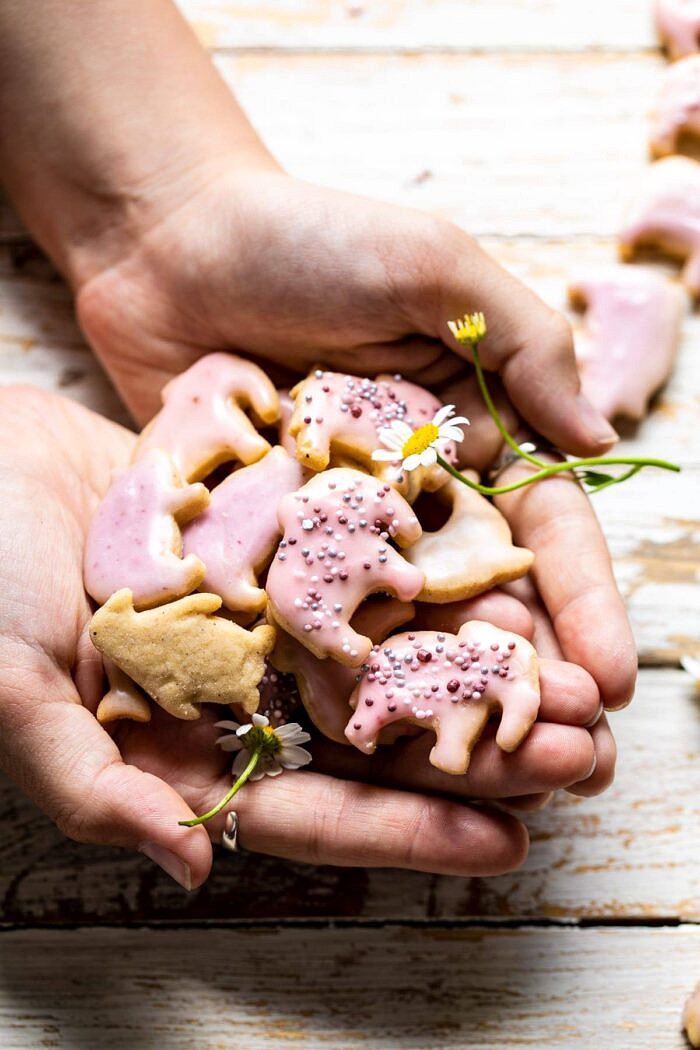 Homemade Animal Crackers | halfbakedharvest.com #crackers #homemaderecipes #cookies #snacks Homemade Animal Crackers being held in 2 hands
