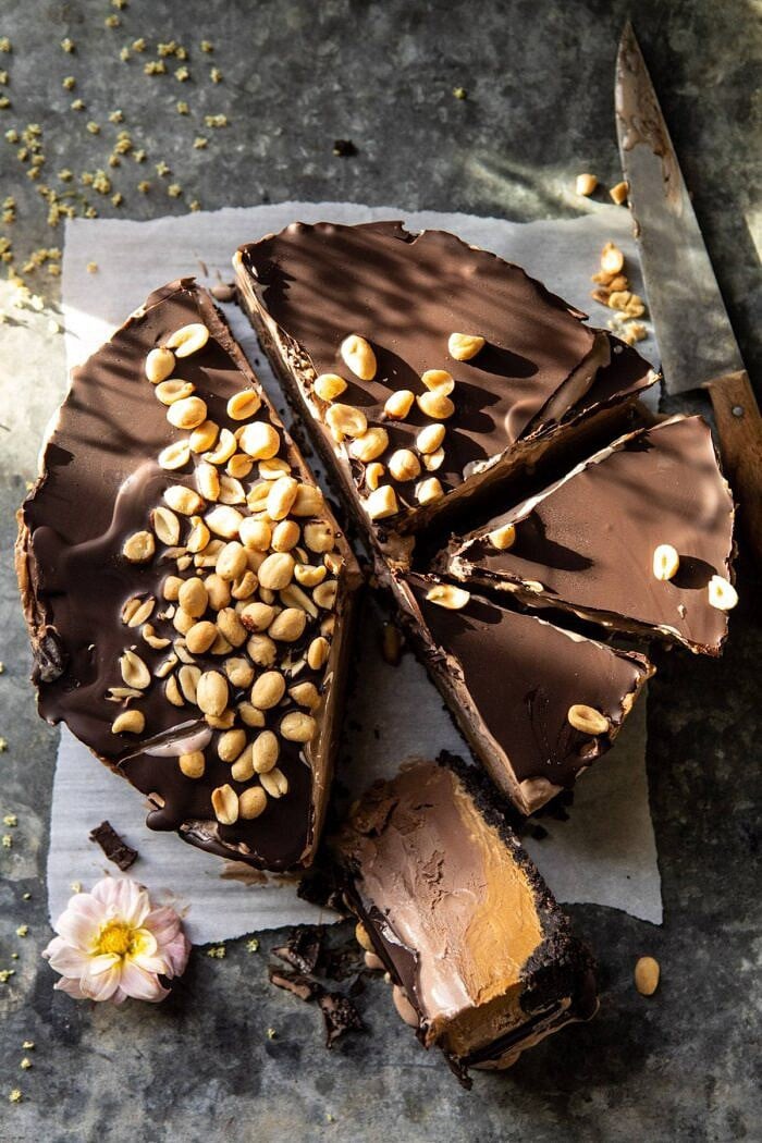Nonnie's 6 Ingredient Chocolate Peanut Butter Ice Cream Cake | halfbakedharvest.com #icecream #easyrecipes #chocolate #peanutbutter #summer overhead photo of Nonnie's 6 Ingredient Chocolate Peanut Butter Ice Cream Cake with 1 slice of cake cut