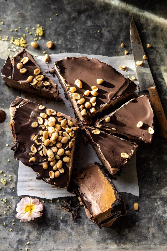 Nonnie's 6 Ingredient Chocolate Peanut Butter Ice Cream Cake | halfbakedharvest.com #icecream #easyrecipes #chocolate #peanutbutter #summer overhead photo of Nonnie's 6 Ingredient Chocolate Peanut Butter Ice Cream Cake with 2 slices cut out of cake