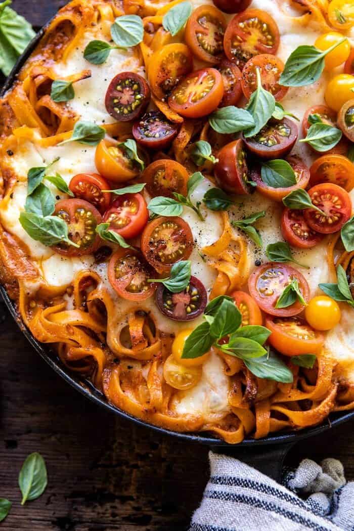 One Pot 30 Minute Creamy Tomato Basil Pasta Bake | halfbakedharvest.com #pasta #summerrecipes #onepot overhead close up photo of One Pot 30 Minute Creamy Tomato Basil Pasta Bake in skillet