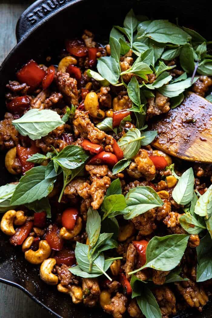 Better Than Takeout Sweet Thai Basil Chicken | halfbakedharvest.com #easyrecipes #20minutes #thaichicken #ricebowl #healthy overhead photo of Better Than Takeout Sweet Thai Basil Chicken in skillet