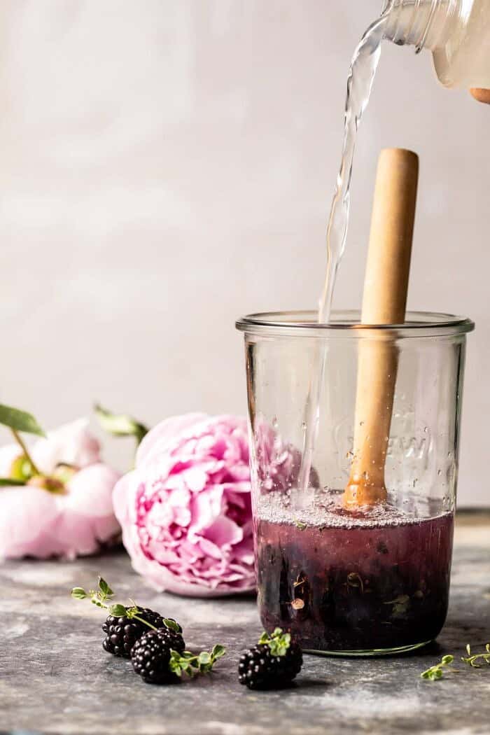 Blackberry Tequila Lemon Cooler | halfbakedharvest.com #cocktail #drinks #blackberries #tequila Blackberry Tequila Lemon Cooler being mixed in jar