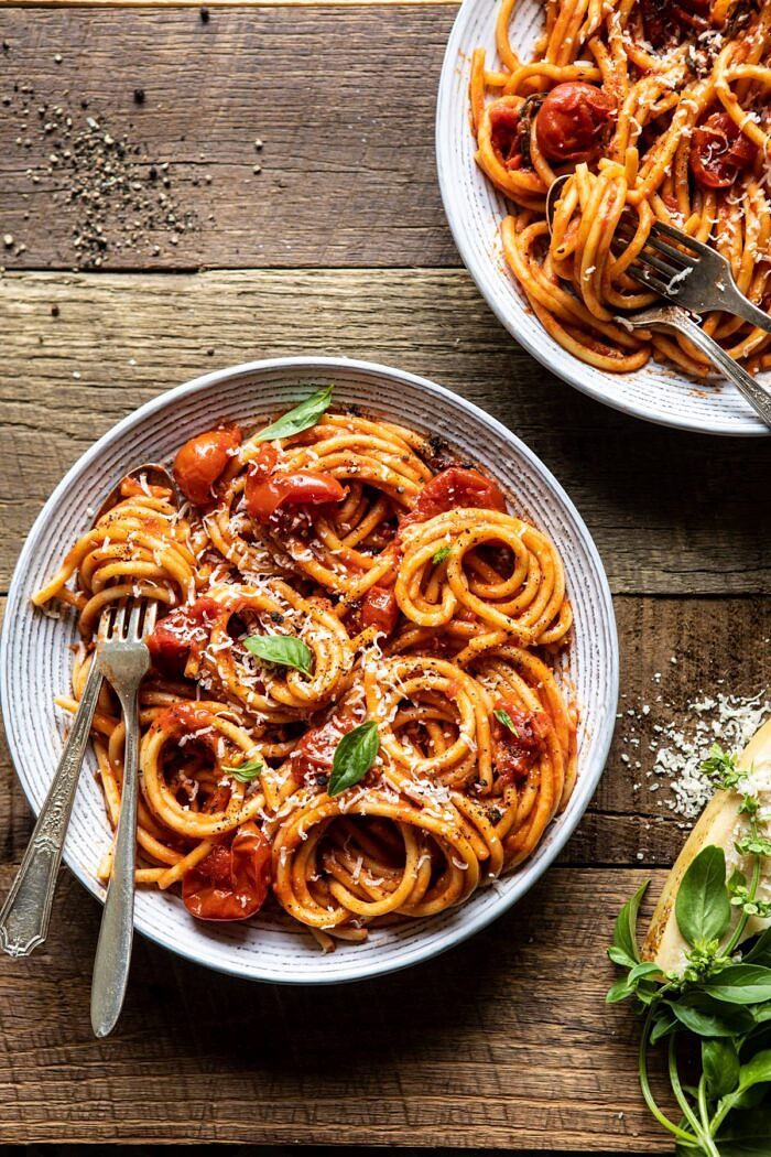 Bucatini Amatriciana | halfbakedharvest.com #pasta #easyrecipes #italian overhead photo of Bucatini Amatriciana with fork and spoon in bowl