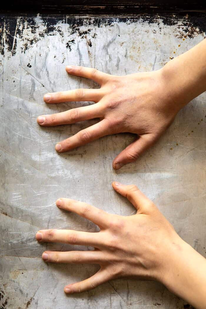 Crispy Salt and Vinegar Smashed Potatoes | halfbakedharvest.com #potatoes #instantpot #easyrecipes #sidedish potatoes on baking sheet being smashed