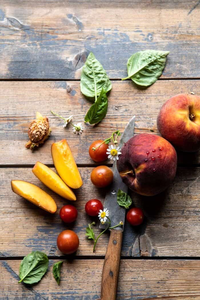 Peaches and tomatoes on wood surface 