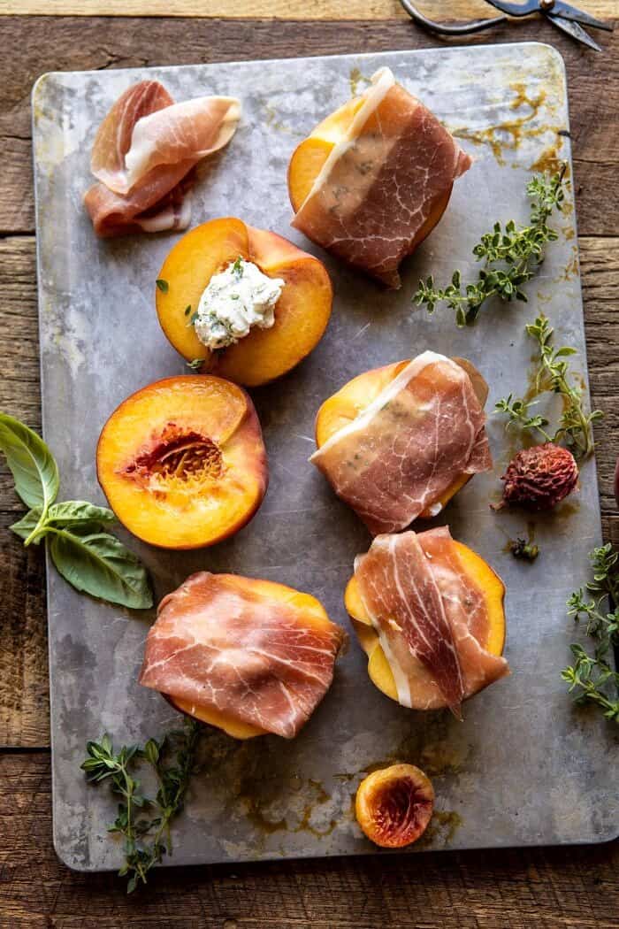 Prosciutto Goat Cheese Stuffed Peaches with Thyme Honey | halfbakedharvest.com #peaches #appetizer #goatcheese overhead photo of Prosciutto Goat Cheese Stuffed Peaches before grilling