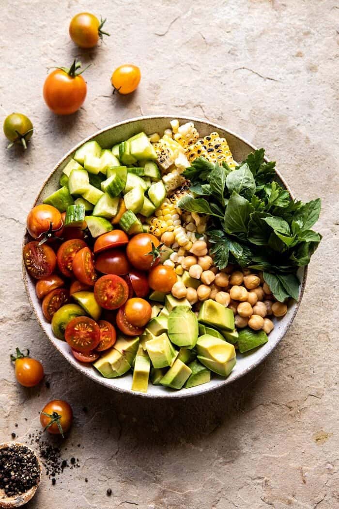 Corn, Tomato, and Avocado Chickpea Salad | halfbakedharvest.com #healthy #tomatosalad #quick #mealprep overhead photo of Corn, Tomato, and Avocado Chickpea Salad before tossing