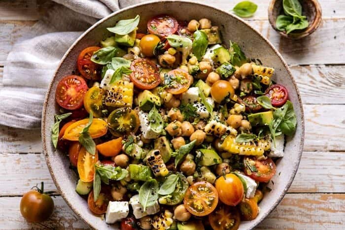 Corn, Tomato, and Avocado Chickpea Salad | halfbakedharvest.com #healthy #tomatosalad #quick #mealprep horizontal photo of Corn, Tomato, and Avocado Chickpea Salad