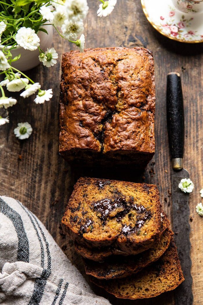 overhead photo of Sneaky Zucchini Chocolate Chunk Coconut Bread with 3 slices cut and melted chocolate inside bread
