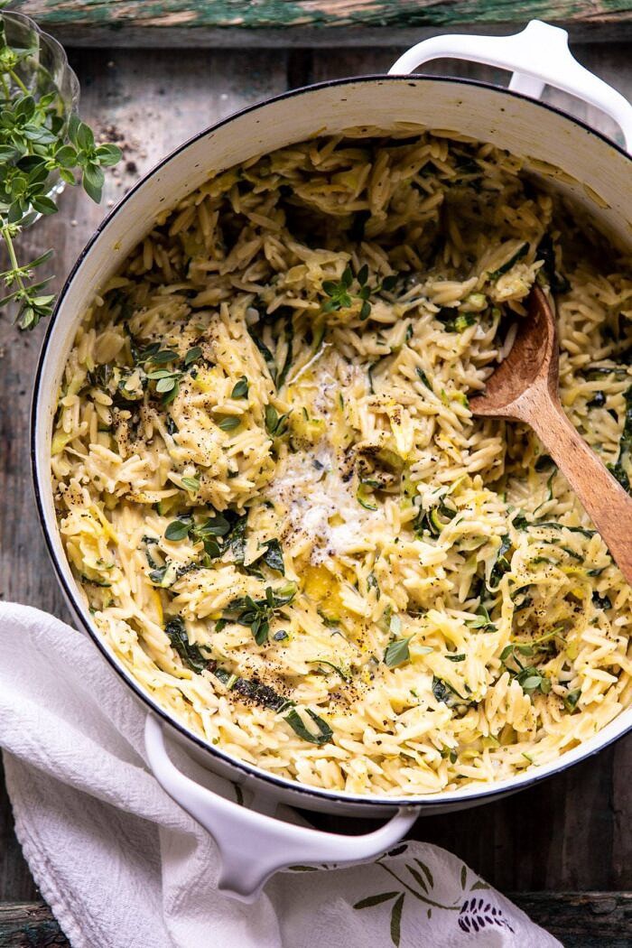 Souper Creamy Lemon Butter Cheesy Zucchini Orzo | halfbakedharvest.com #orzo #easyrecipes #zucchini overhead close up photo of Souper Creamy Lemon Butter Cheesy Zucchini Orzo