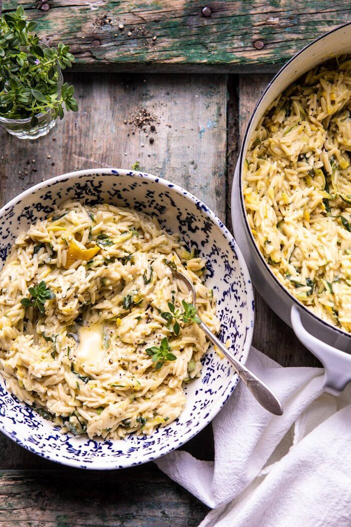 Souper Creamy Lemon Butter Cheesy Zucchini Orzo | halfbakedharvest.com #orzo #easyrecipes #zucchini overhead photo of Souper Creamy Lemon Butter Cheesy Zucchini Orzo in serving bowl