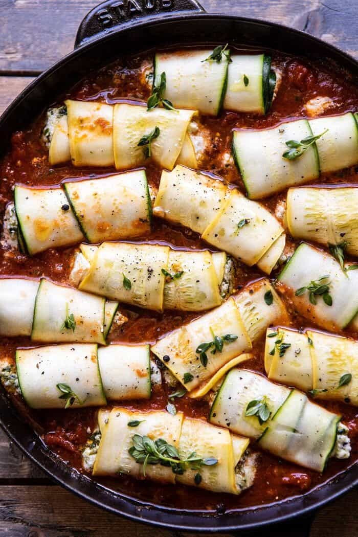 Spicy Pesto and Cheese Stuffed Zucchini Involtini | halfbakedharvest.com #zucchini #cheese #Italian #easyrecipes overhead photo of Spicy Pesto and Cheese Stuffed Zucchini Involtini before baking