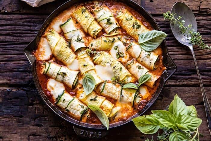 Spicy Pesto and Cheese Stuffed Zucchini Involtini #zucchini #cheese #Italian #easyrecipes horizontal photo of Spicy Pesto and Cheese Stuffed Zucchini Involtini