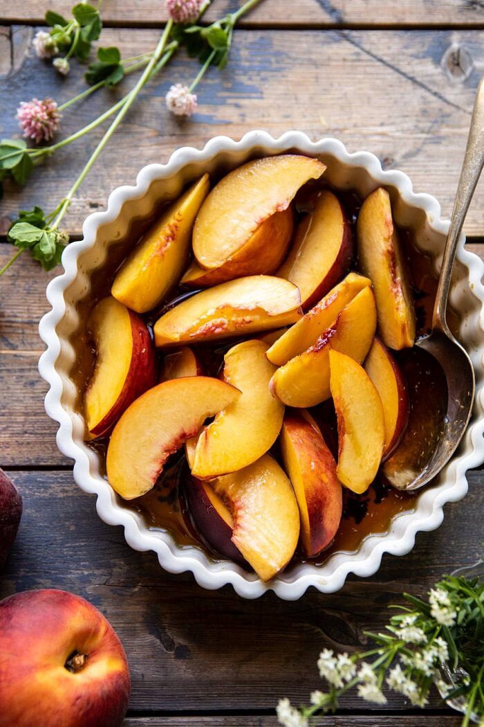 Peaches and Cream Pretzel Pie | halfbakedharvest.com #pie #peach #summer #dessert #easy overhead photo of Peaches in honey