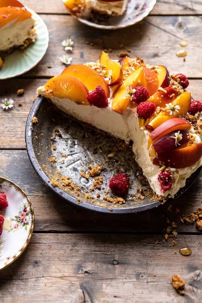 Peaches and Cream Pretzel Pie | halfbakedharvest.com #pie #peach #summer #dessert #easy side angled photo of Peaches and Cream Pretzel Pie with slices removed from pie
